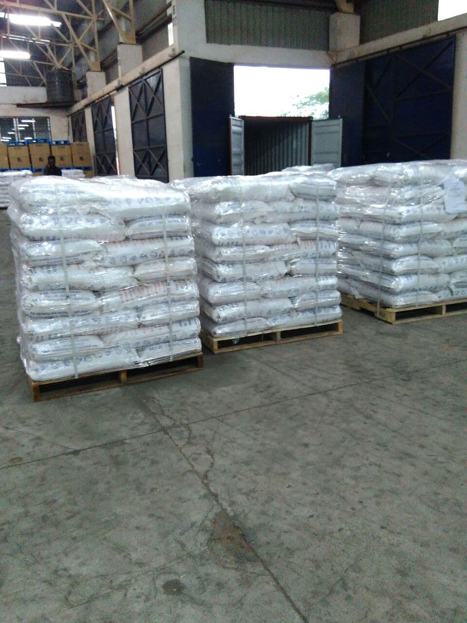 Bags stacked and strapped on pallets in the warehouse